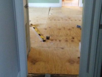 Extra subfloor underlayment in order to do away with a threshold.