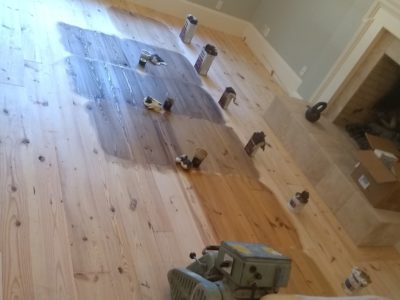 Here is a glue down sand and finish, heart pine floor, currently in progress in ...